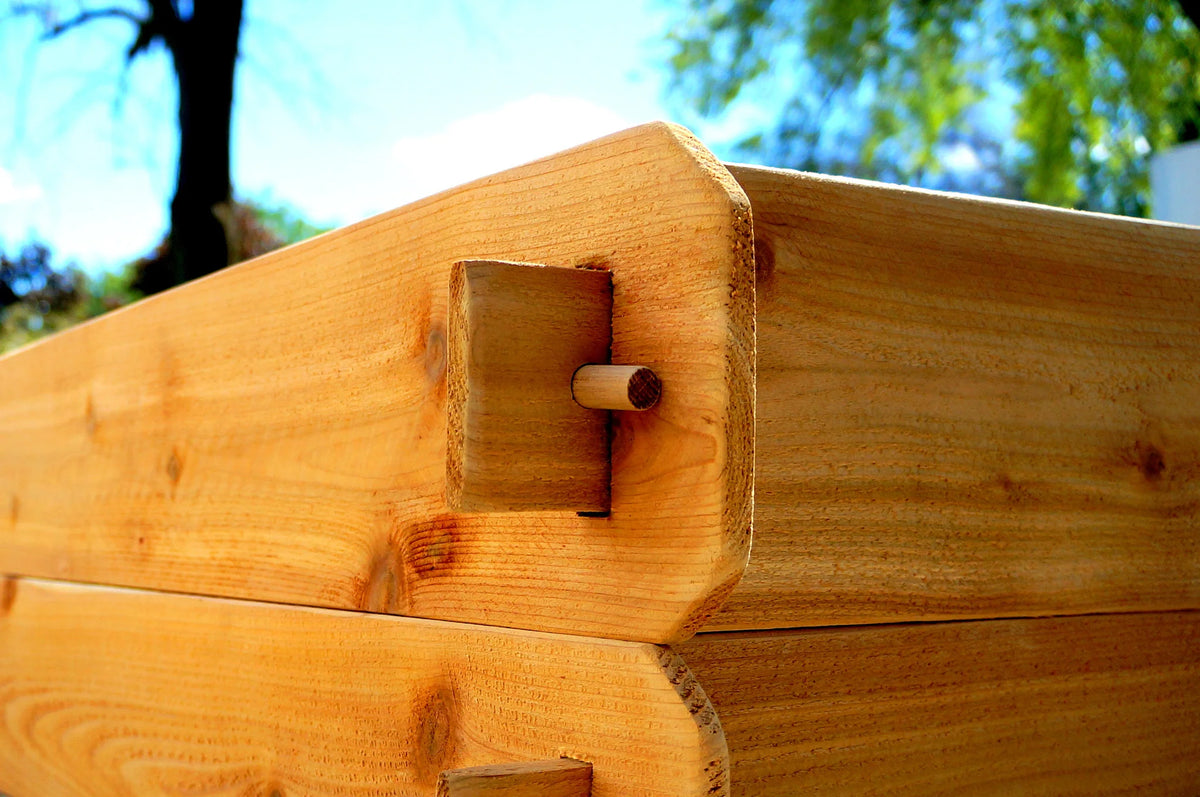 Cedar raised garden bed corner showing handcrafted mortise and tenon joint detail by Timberlane Gardens, no tools needed and made in the USA.